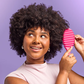 Wet Brush inside a gym bag showing convenience for on-the-go curl refreshes