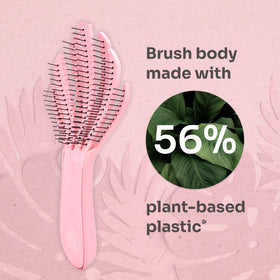 Wet Brush detangling wet curly hair with minimal pulling for pain-free styling