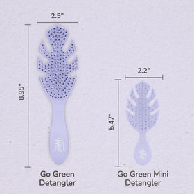 Wet Brush detangling through conditioner to help distribute product without damage