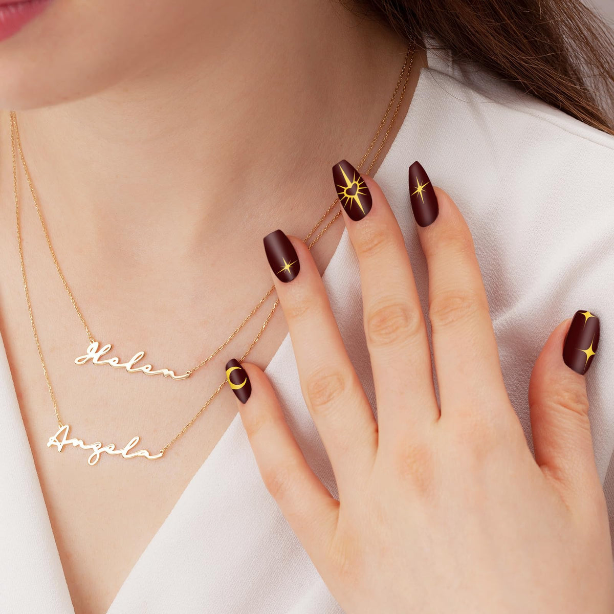 Whaline finished manicure with sun, moon and stars showcasing creative results
