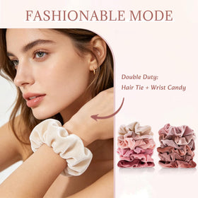 Hand holding a Whaline scrunchie to show scale and comfortable outer diameter for most hair volumes