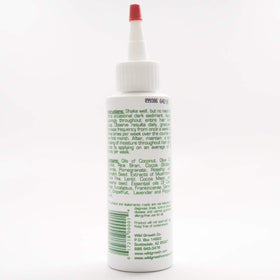 Wild Growth oil applied to hair ends demonstrating smoother, detangled strands