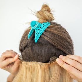 WILLBOND clips attached to a wig weft demonstrating easy secure fastening