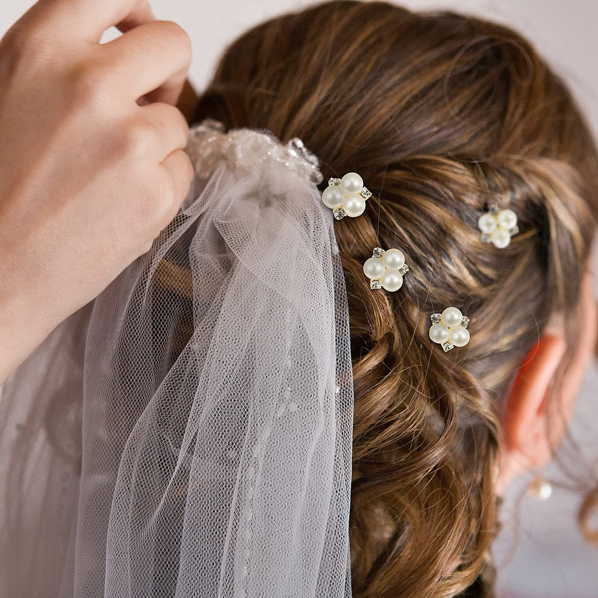 WILLBOND hair pins used in a bridal updo adding elegant accents to style