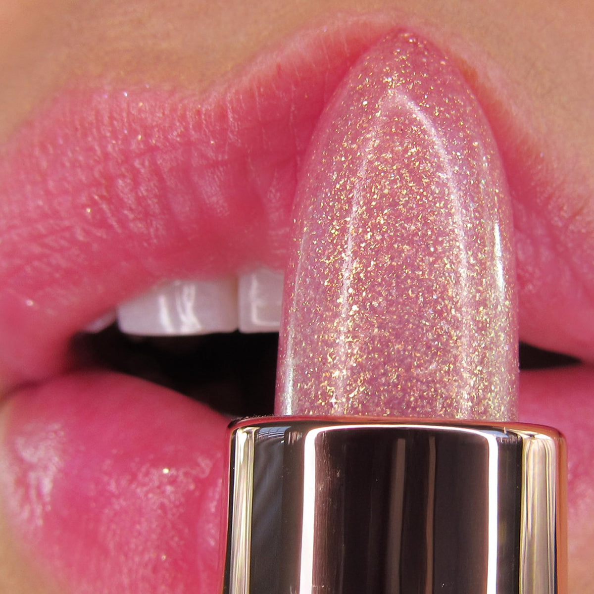Winky Lux balm applied on lips demonstrating personalized pink tint and moisturizing effect
