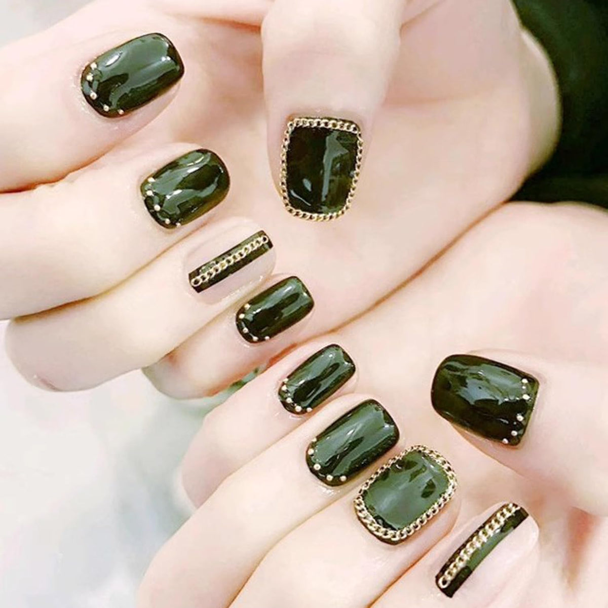 WOKOTO lifestyle shot of party manicure featuring chains for eye-catching glam