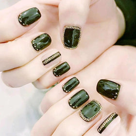 WOKOTO lifestyle shot of party manicure featuring chains for eye-catching glam