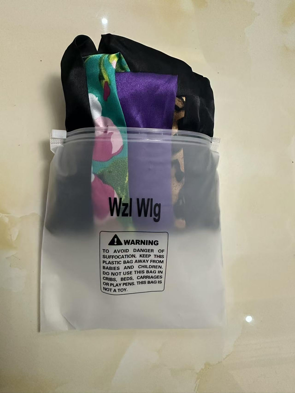 Wzl Wlg bonnet on hand for scale, demonstrates generous size benefit