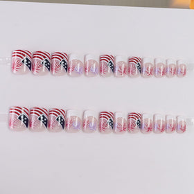 Xenophoer close-up of mixed American flag and accent nail designs for festive styling