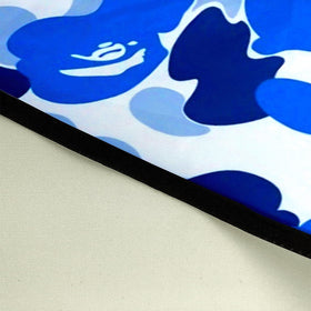 Xianjing camo cape water-shedding demo showing liquid resistance and quick-dry