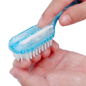 Xjinmin brush scrubbing a foot in shower demonstrating gentle exfoliation