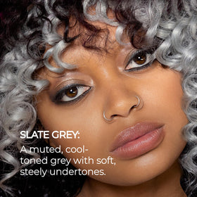 XMONDO model in studio with muted slate grey hair, showcasing finish