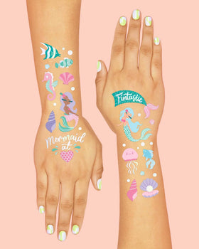 xo, Fetti application demo of adult applying tattoo to child's arm for easy use