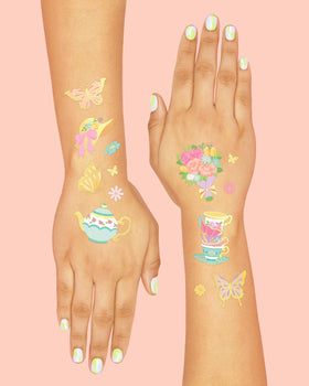 xo, Fetti applied teacup tattoo on child's wrist demonstrating easy wear