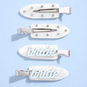 xo, Fetti front view of four white bridal hair clips showing blue script and rhinestones as pretty accessories