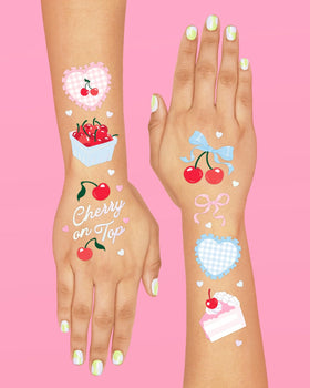 xo, Fetti hand applying tattoo with damp cloth demonstrating quick application
