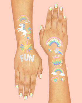 xo, Fetti child wearing rainbow tattoo on arm for playful party look