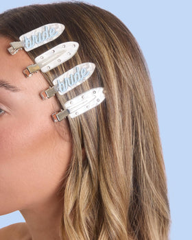 xo, Fetti clips used in a bridal updo demonstrating secure hold during hair styling and makeup