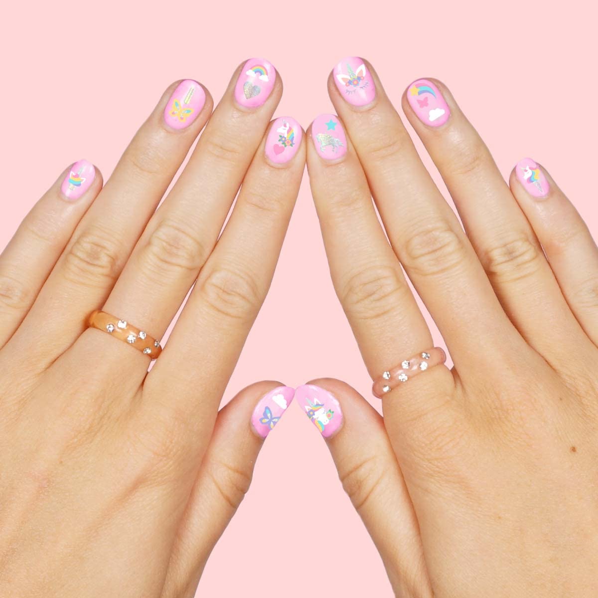 xo, Fetti decal being applied on a child’s nail for quick party manis
