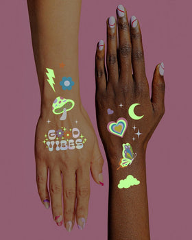 xo, Fetti tattoos glowing in dark emphasizing nighttime visibility for rave events