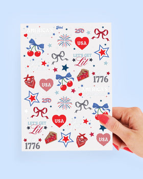 xo, Fetti sheets laid on pool towel showing summer party use