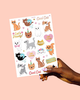 xo, Fetti tattoo sheet held in hand illustrating sheet size and scale