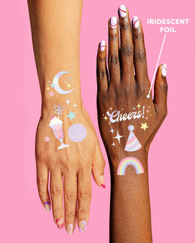 xo, Fetti sheet next to hand to show tattoo sizes for easy planning