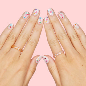 xo, Fetti stickers applied on polished nails demonstrating quick, cute results
