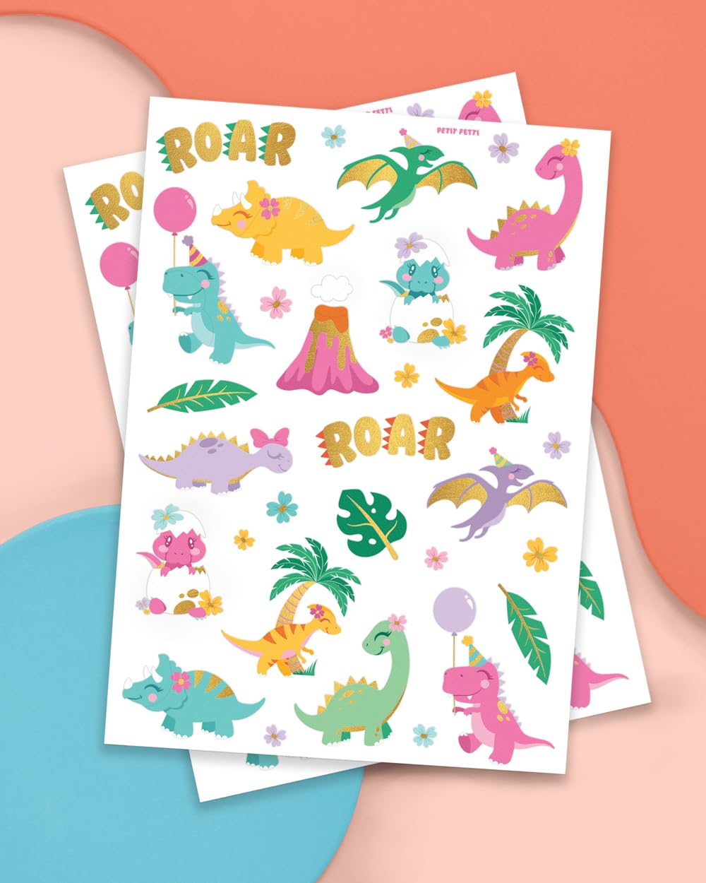 xo, Fetti close-up of tattoo sheet showing colored dinosaur artwork and details