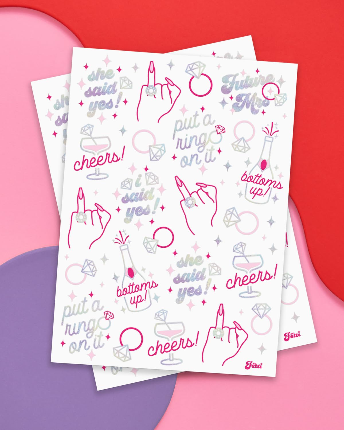xo, Fetti two full sheets laid flat displaying 46 foil designs for guest sharing