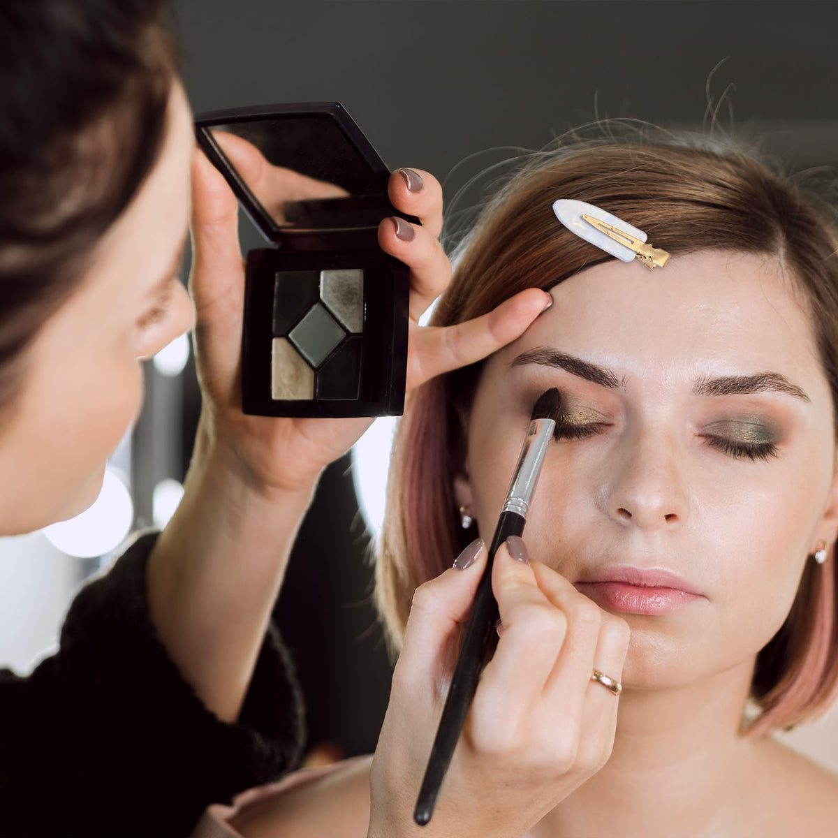 Xthrotsenk clip holding hair during makeup offering hands-free convenience for beauty routines