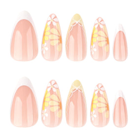 XZMeiLun close-up of yellow floral nail art highlighting intricate details and polish finish