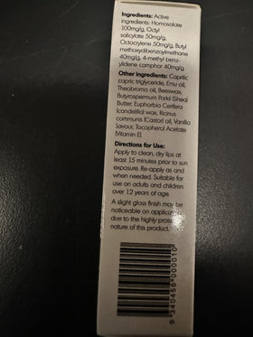 Y Not Natural lip balm on a beach towel illustrating outdoor sun protection use