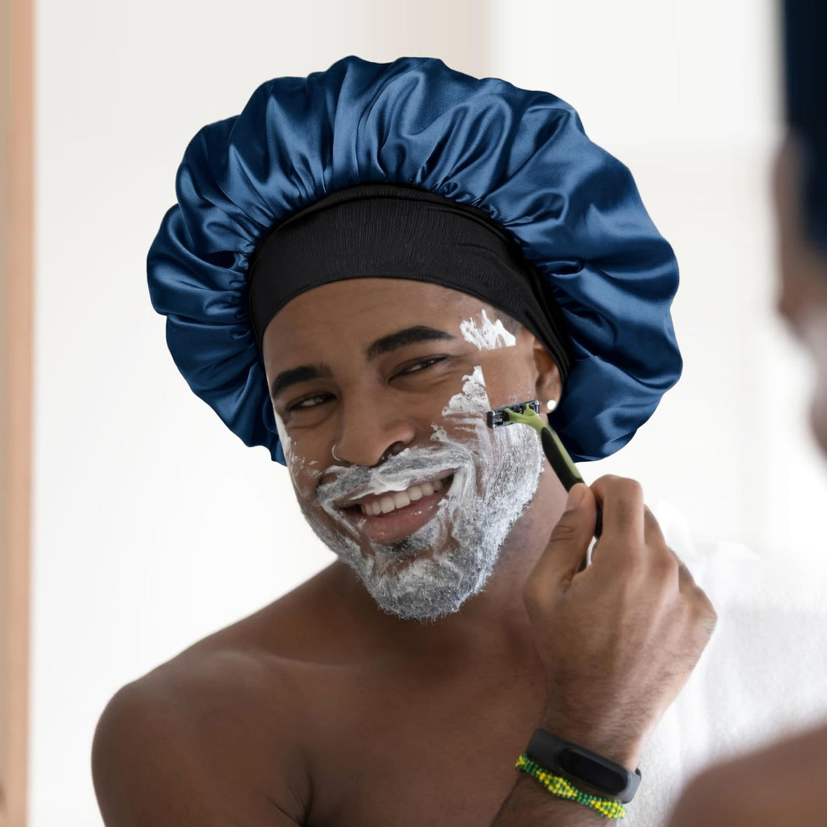 YANIBEST unisex model wearing bonnet to protect curly hair and preserve styles