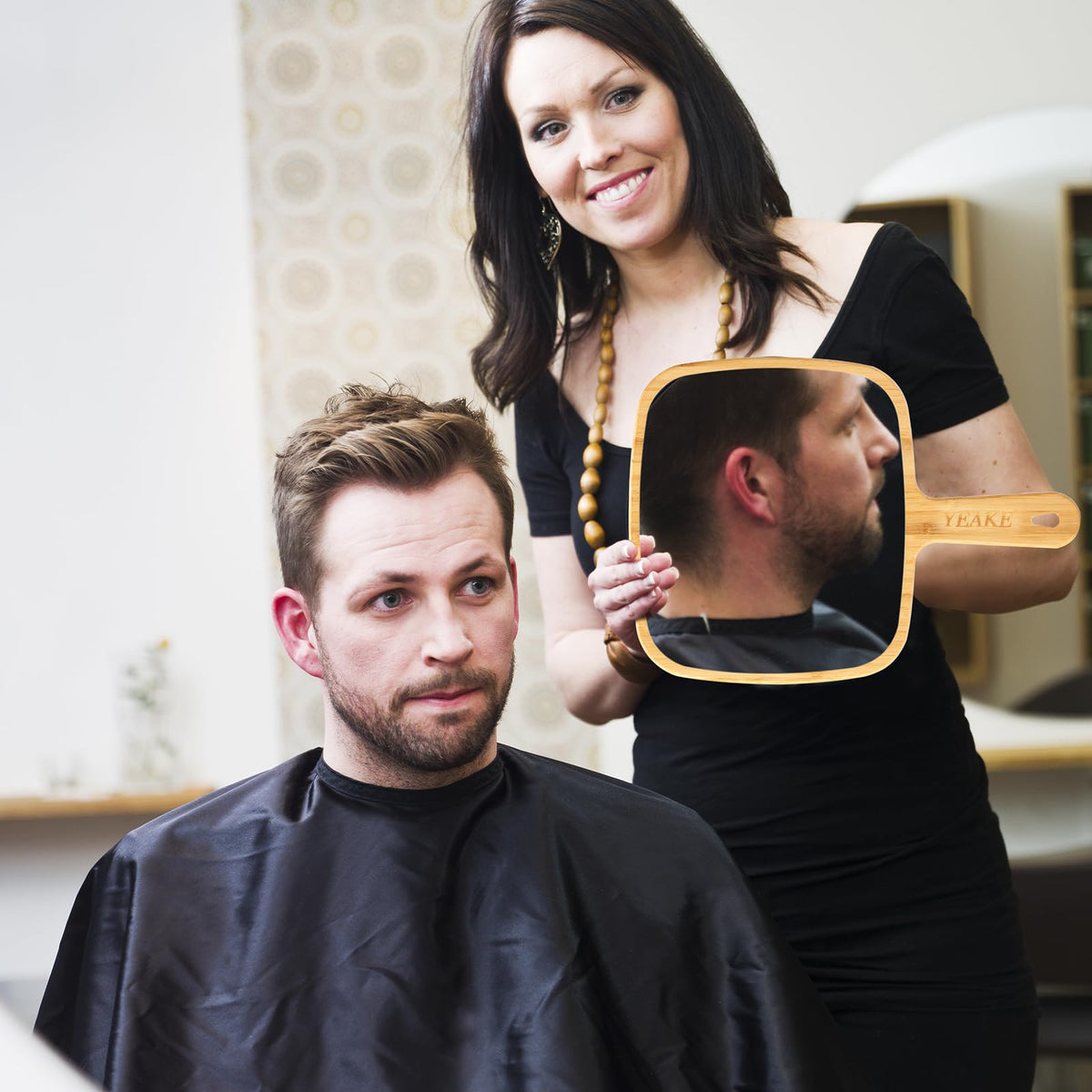 YEAKE handheld use demonstration showing ergonomic handle for steady styling