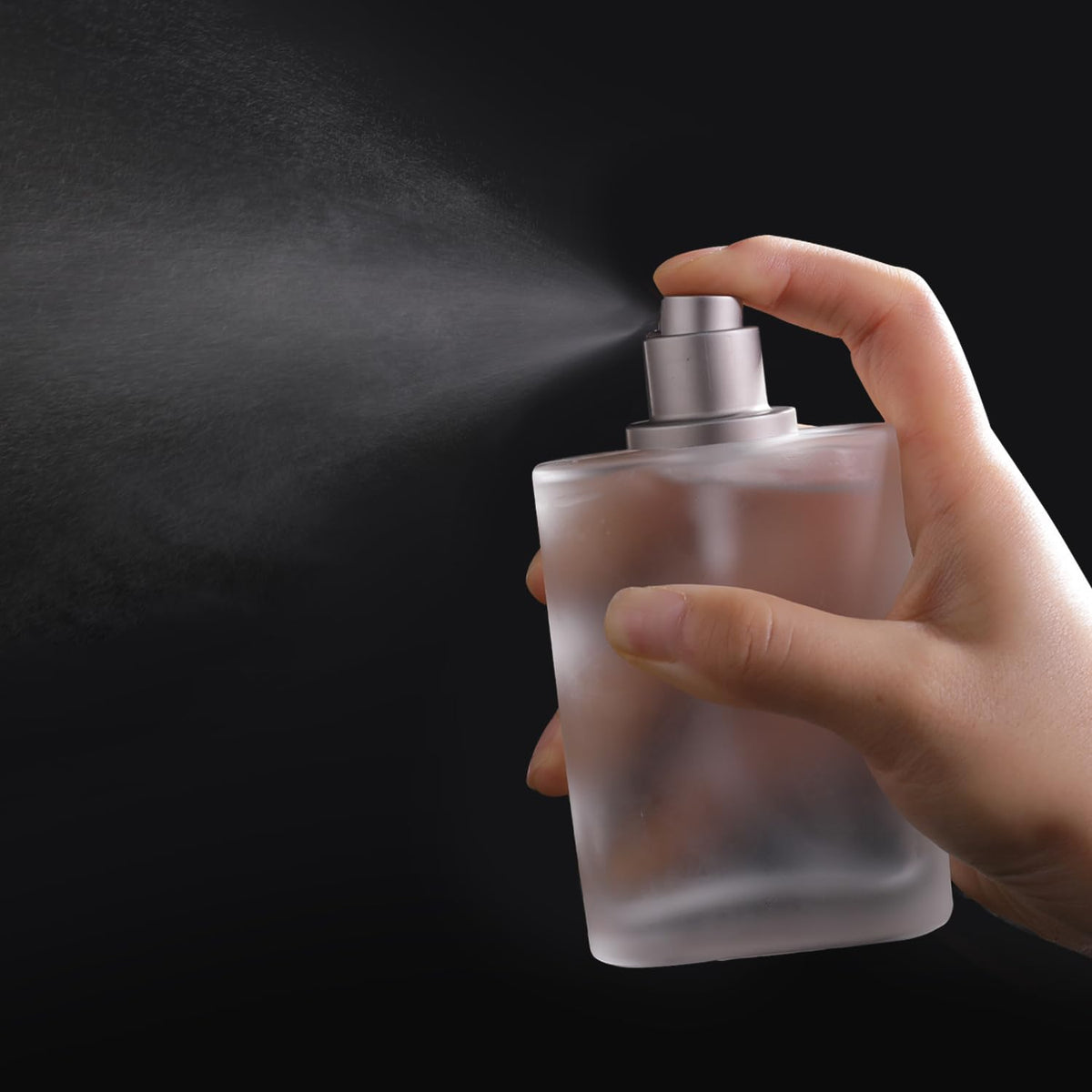 Yerpkefey bottle held in hand to show 100ml scale and travel-friendly size