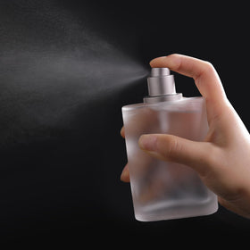 Yerpkefey bottle held in hand to show 100ml scale and travel-friendly size