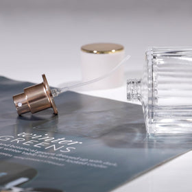 Yerpkefey spraying perfume into air illustrating delicate mist for even fragrance distribution