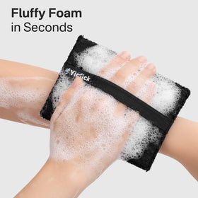 Yiclick next to a hand showing size and coverage for full-body use