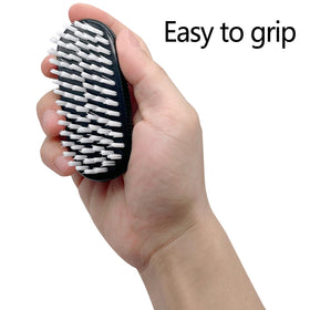 Ylijxqc brush held in hand to show size and portability advantage