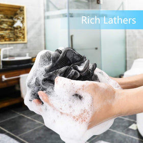 YOGET loofah held in hand to show 4.7 inch size and comfortable grip