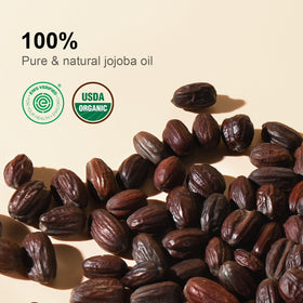 Golden jojoba oil being poured, shows smooth texture and absorbency