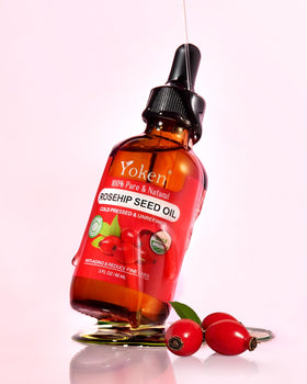 Yoken rosehip oil dropper dispensing a controlled drop for precise application
