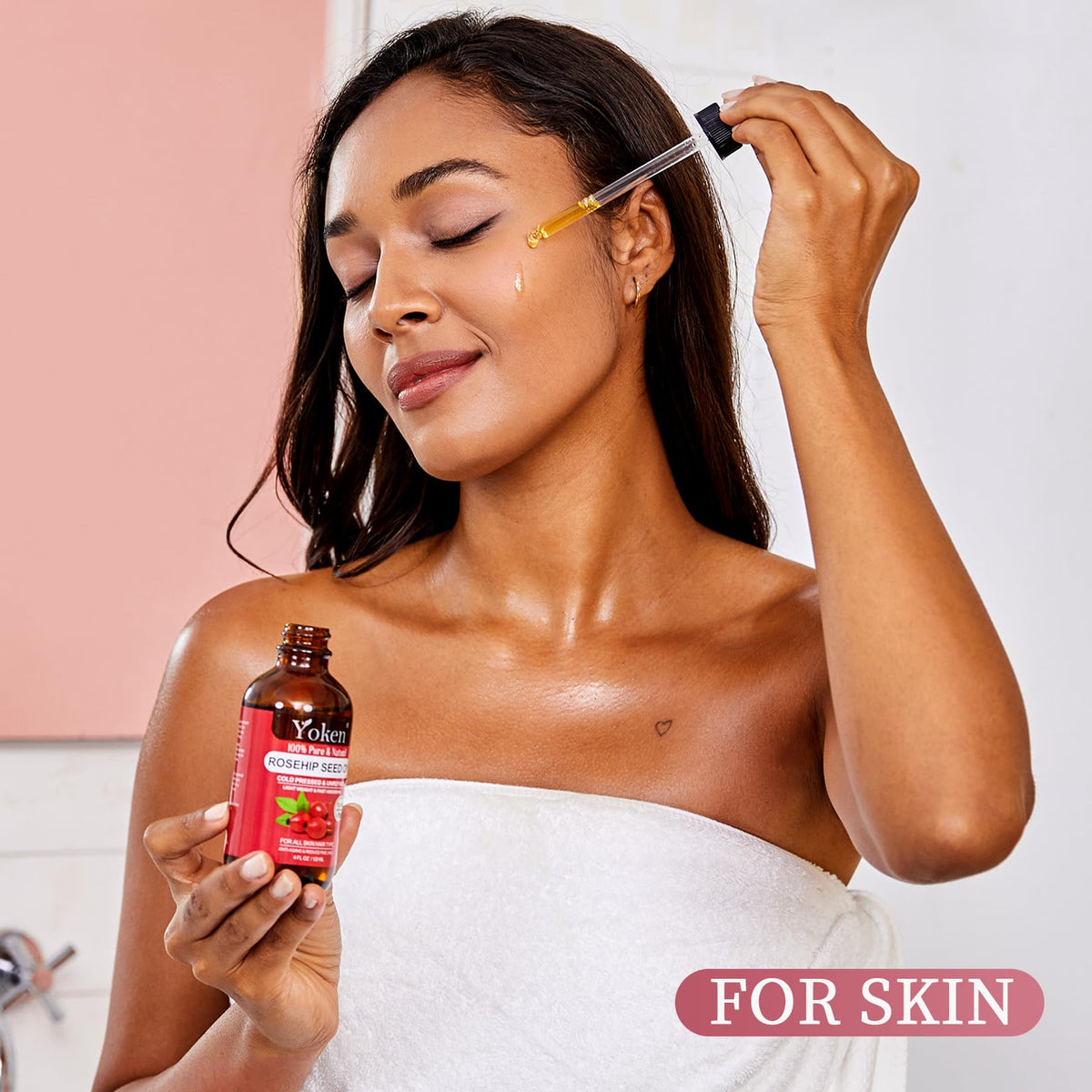 Yoken oil pouring with a drop highlighting smooth texture and absorption