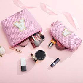 yoolife pouch on a vanity set portraying stylish travel-ready organisation benefit