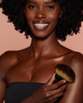 YOSHUYUKI brush next to lotions and bronzers for multi-product use