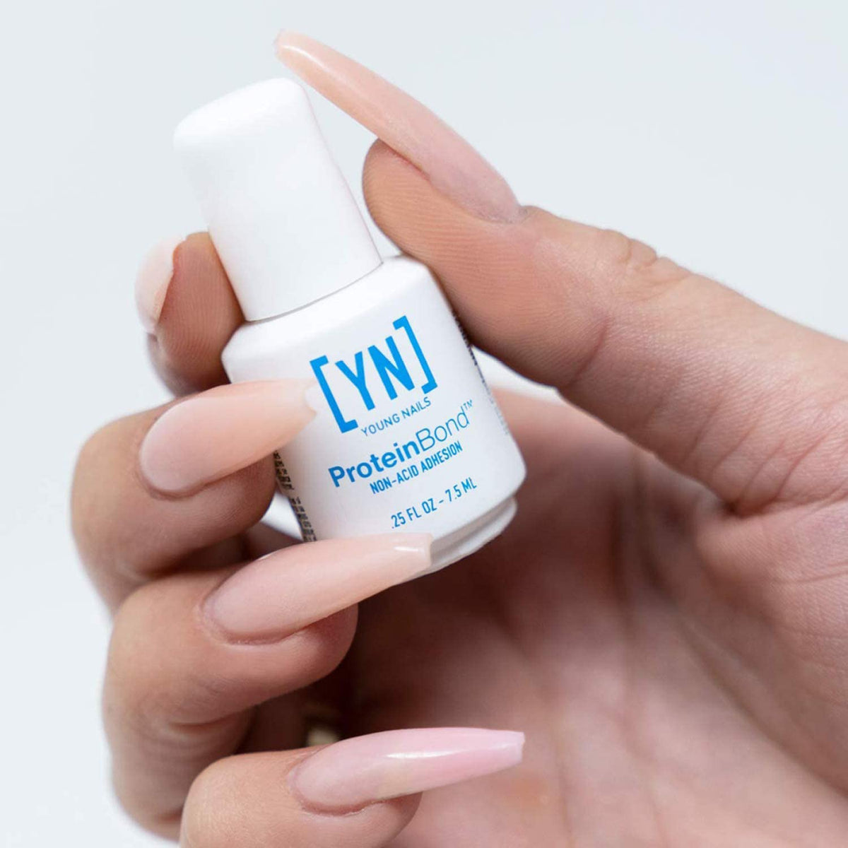Young Nails Protein Bond liquid texture close-up showing thin bondable formula