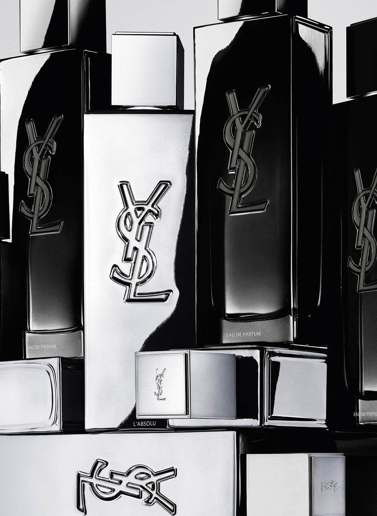 Yves Saint Laurent bottle next to hand for size comparison and practical portability