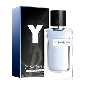 Yves Saint Laurent bottle on evening table setting conveying refined, modern presence benefit