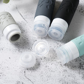 Zafit bottles filled with shampoo and conditioner, ready for travel convenience